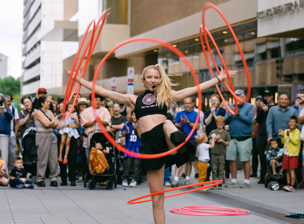 Case Study: SLC Busker Fest Event Photography & Event Marketing by Elle Marketing and Events | hula hoop show