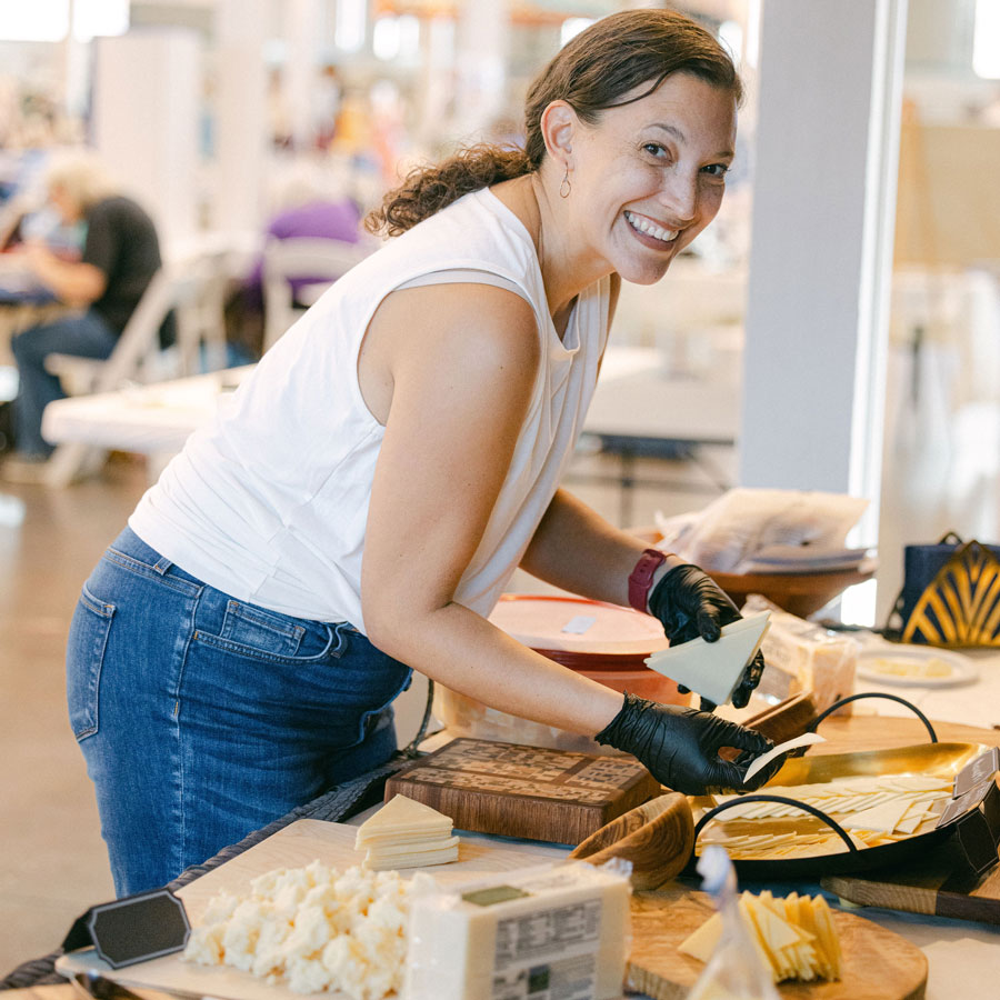 Lydia-State-Fair-Cache-Valley behind the scenes shot with Lydia prepping Cache Valley Creamery event at Utah State Fair