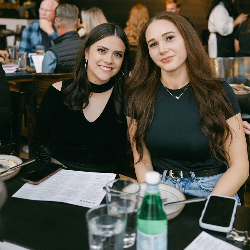 Kayla and Daisy at team dinner