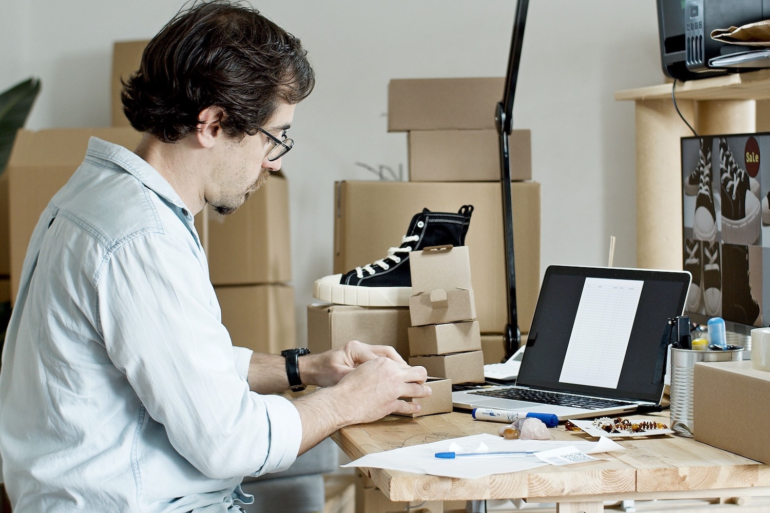 Elle Marketing and Events, mall business owner preparing customer orders while managing daily business operations