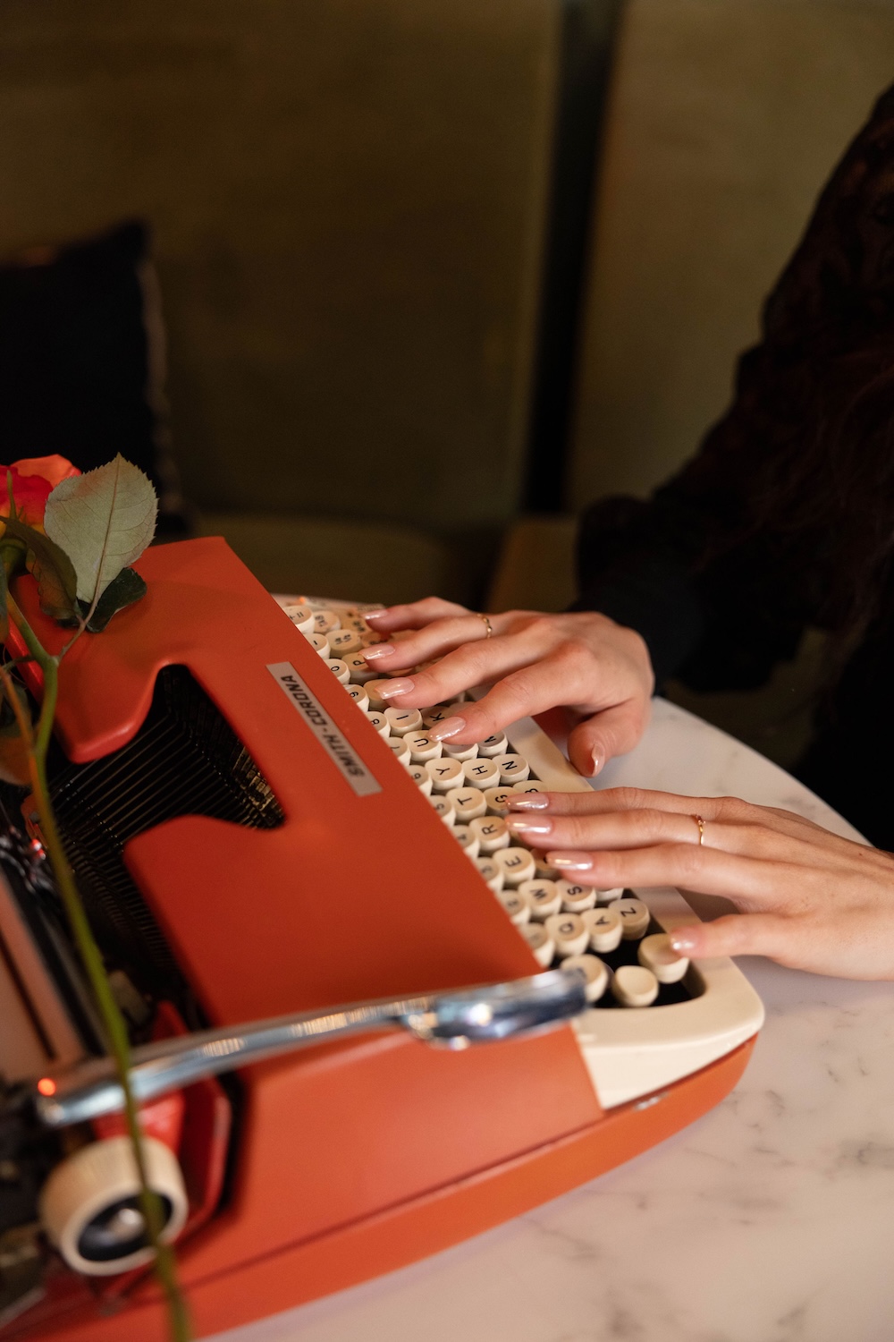 Writing content with a typewriter to represent consistent brand messaging and voice.