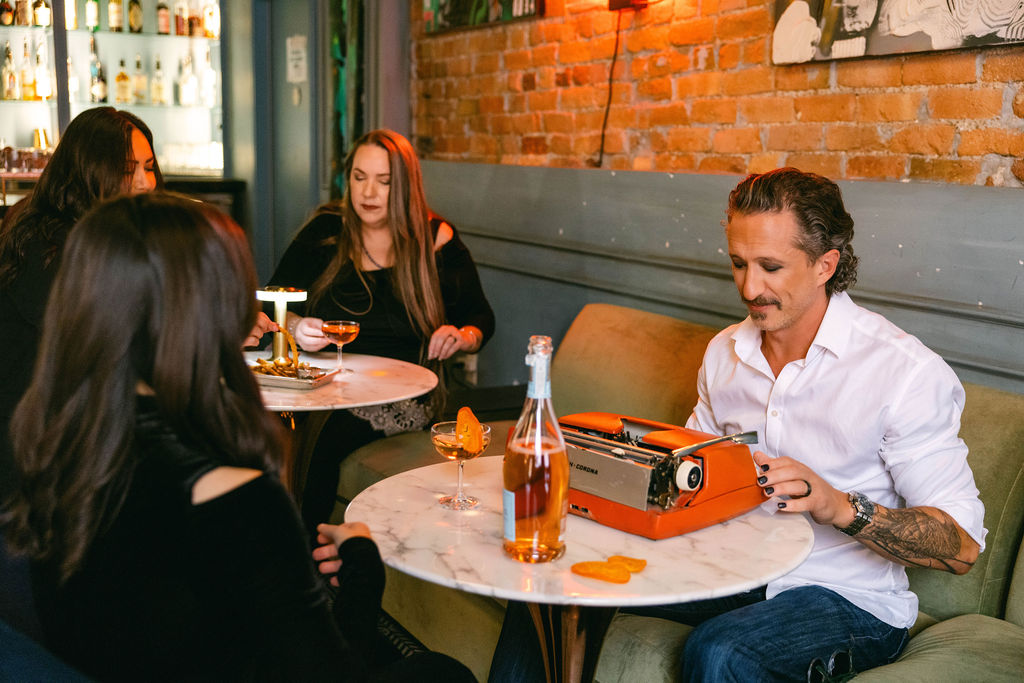 Elle Marketing and Events team collaborating on an integrated strategy in a restaurant setting
