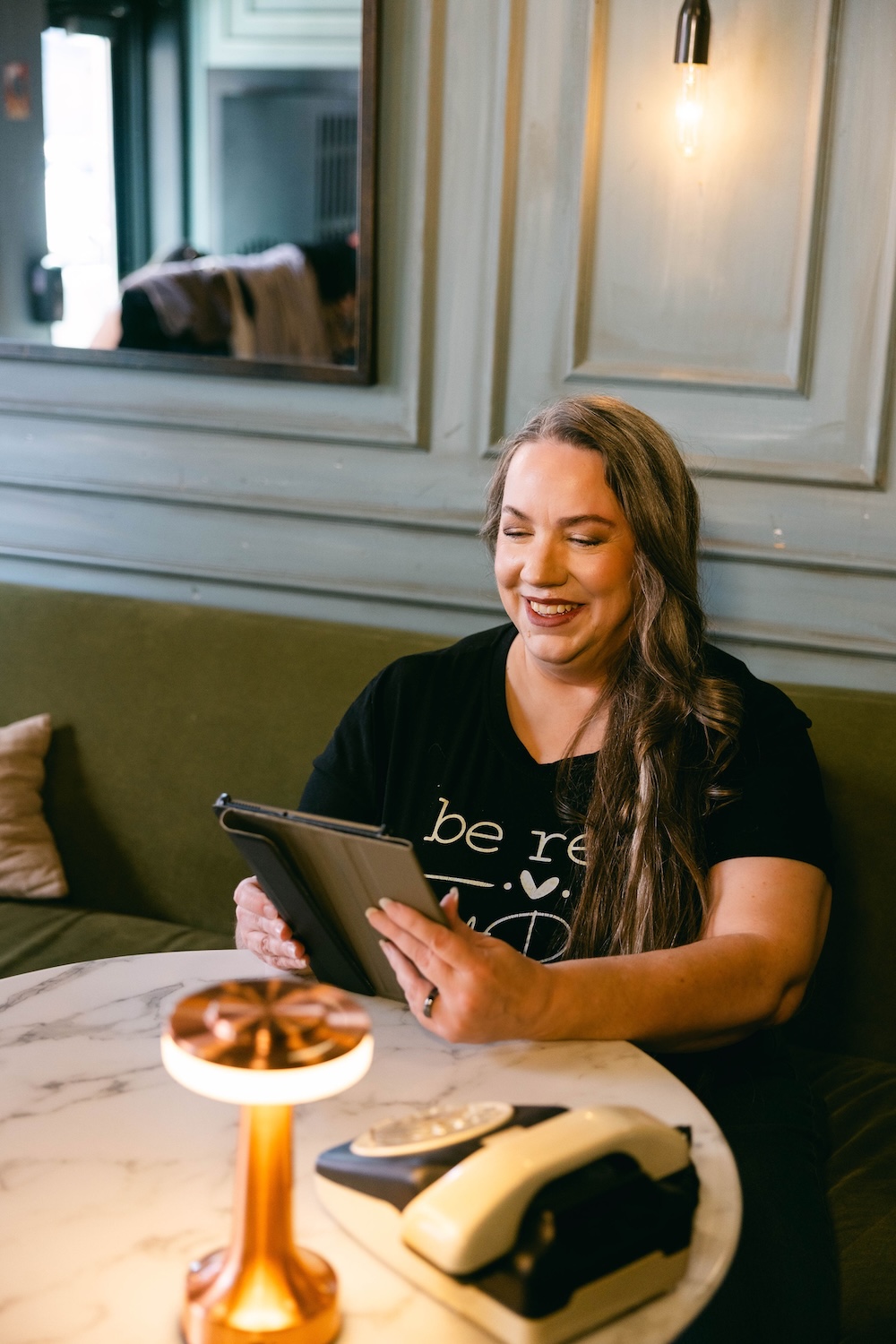 Elle Marketing Web Developer Paula Sageser working on digital marketing preparations for a client campaign.